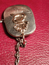 Charger l'image dans la galerie, Reste d'un morceau d'une louche en argent de la société des Vieux grenadiers de Genève, transformée en pendentif.