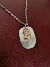 Charger l'image dans la galerie, Reste d'un morceau d'une louche en argent de la société des Vieux grenadiers de Genève, transformée en pendentif.