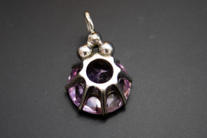 Pendentif argent massif et topaze rose bébé synthétique.