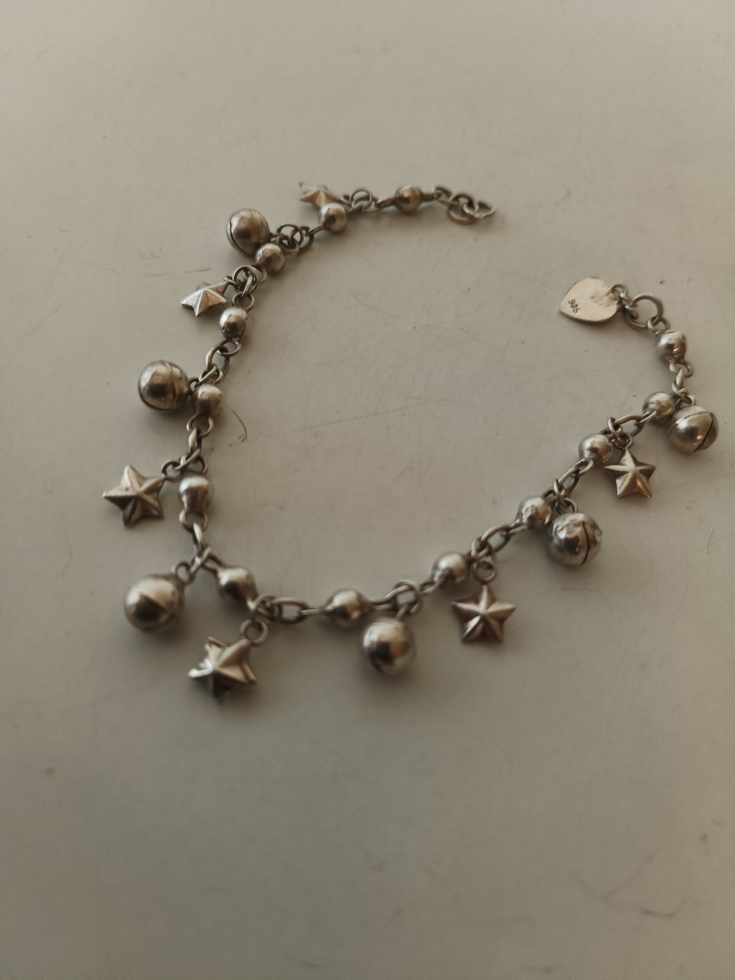 Bracelet étoiles et clochettes en argent massif