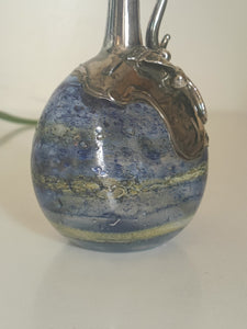 Vase en verre soufflé irisé, et argent apposé. Milieu XXÈME