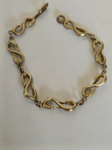 Rare bracelet à double col de cygne en laiton probablement XIXÈME réparation au fermoir dans les règles de l'art