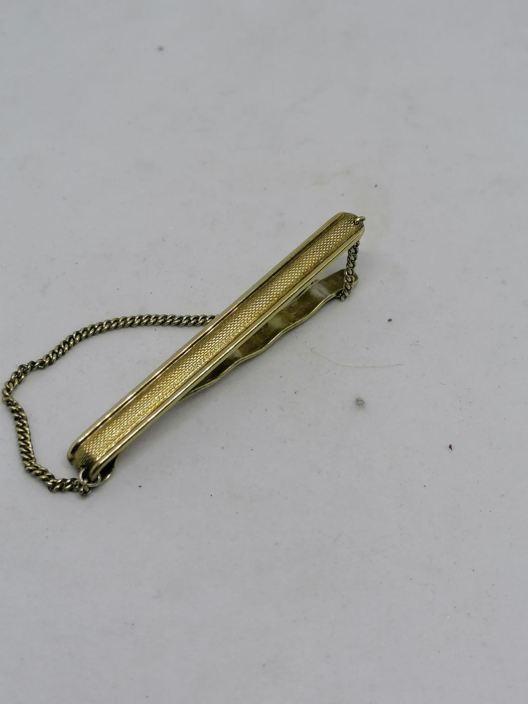 Pince à cravatte argent vermeil.