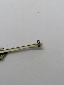 Broche polo en argent.