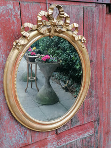 Miroir ovale 19ème doré à la feuille d'or