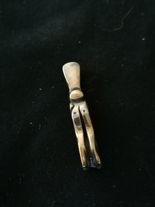 Pendentif totem en argent massif.