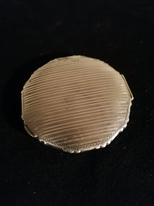 Boîte à poudrer et miroir en argent 0.800 ciselé. 